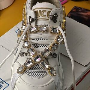 Brand-New never worn. Beautiful shoe w/removable strap embellishment.